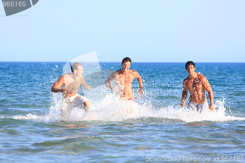 Image of Men Relaxing On the Beach