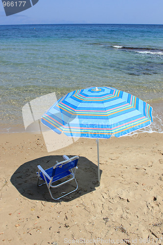 Image of An empty chair on a  beach 