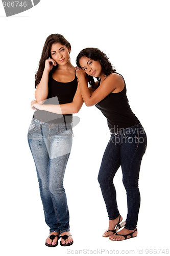 Image of Young woman couple standing