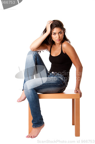 Image of Fashion woman with jeans sitting