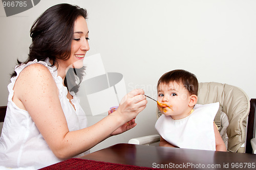 Image of Infant eats messy