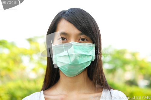 Image of woman wear facemask outdoor