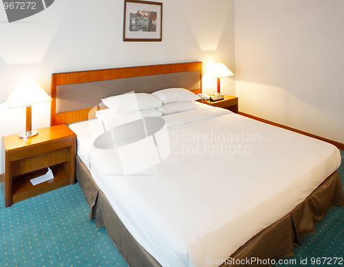 Image of Double bed in a confortable hotel room