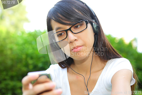 Image of girl listen to music with headphones, chinese