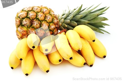 Image of banana bunch with pineapple