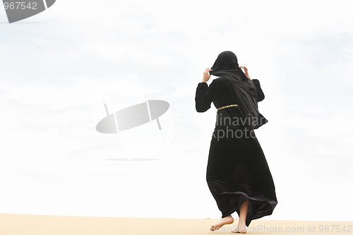 Image of Woman going by sand hill crest