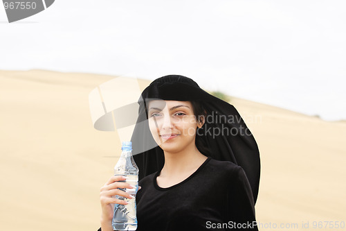 Image of Smiling woman with water bottle