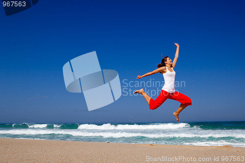 Image of Young woman jumping