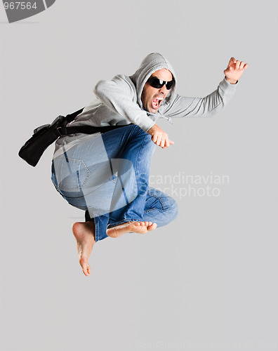 Image of Young man jumping