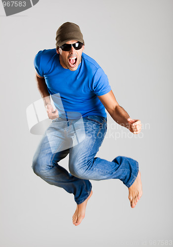 Image of Young man jumping