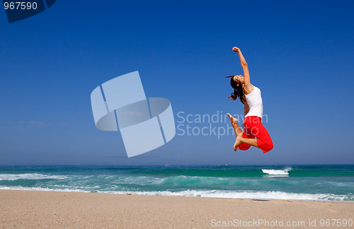 Image of Young woman jumping