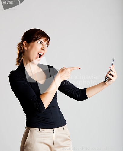 Image of Unhappy woman at cellphone