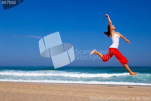 Image of Young woman jumping
