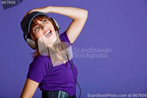 Image of Beautiful woman listening music