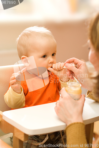 Image of Feeding a little baby boy