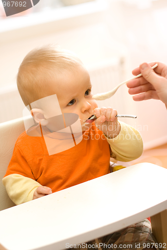 Image of Feeding a little baby boy