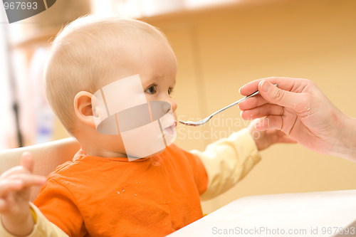 Image of Feeding a little baby boy