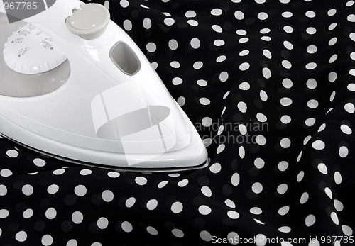 Image of Ironing delicate polka fabric