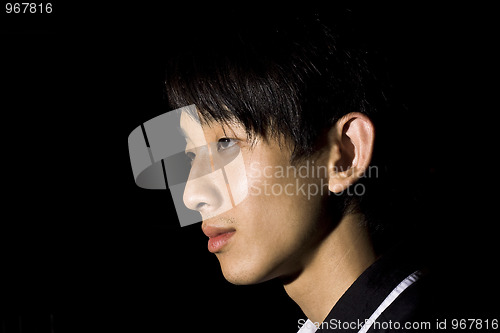 Image of Portrait of an Asian man in the darkness 