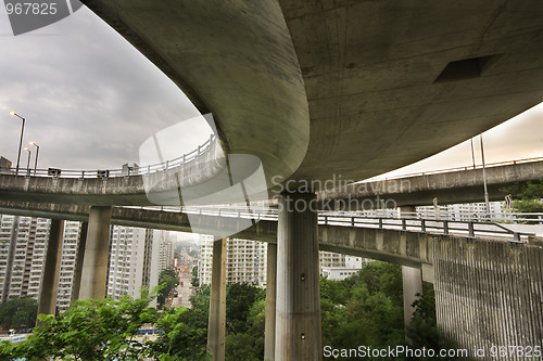 Image of Modern urban city with freeway traffic bridge at day