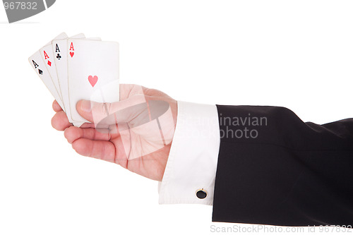 Image of man's hand with four aces