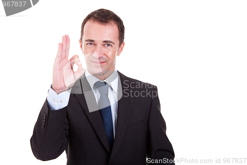 Image of handsome businessman with thumb raised as a sign of ok