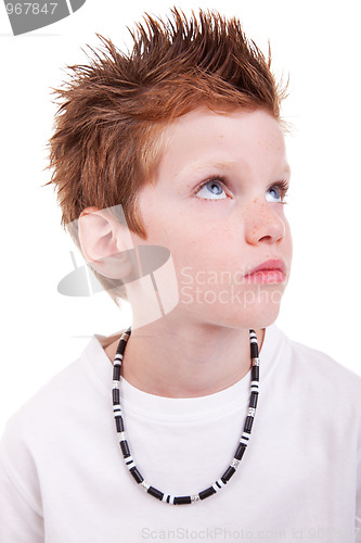 Image of cute boy with a serious look, looking up