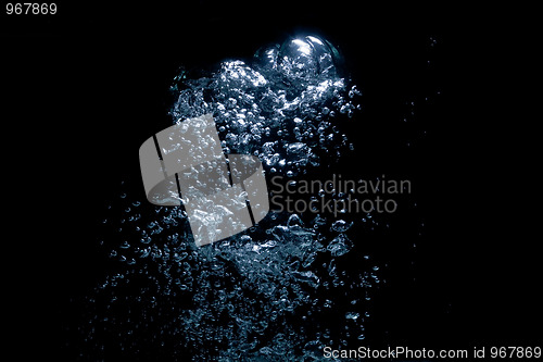 Image of air bubbles rising over black