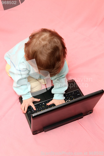 Image of baby with laptop