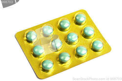 Image of Package of green pills isolated on white