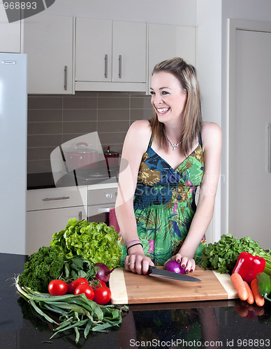 Image of young woman preparing healthy vegetables