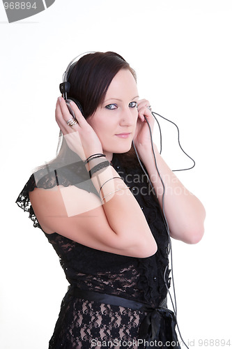 Image of young woman listening headphones