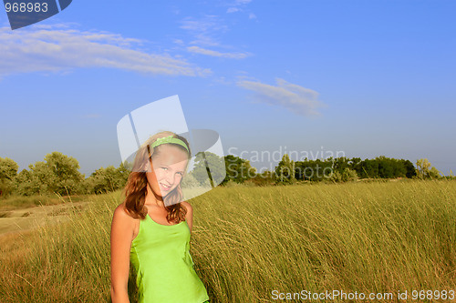 Image of Teenage girl among the high grass