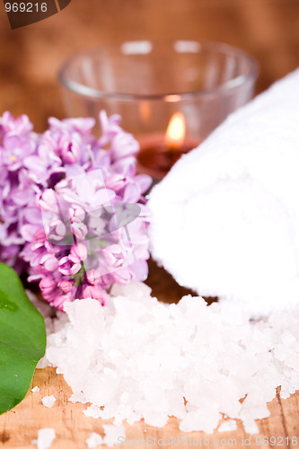 Image of lilac, bath salt, towel and candle