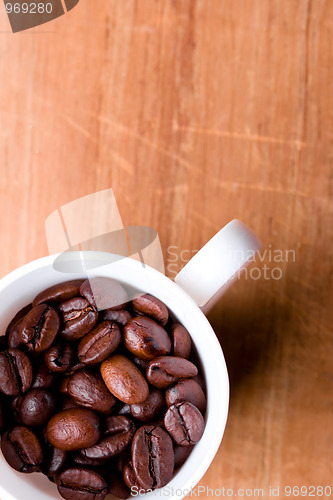 Image of cup full of coffee beans 
