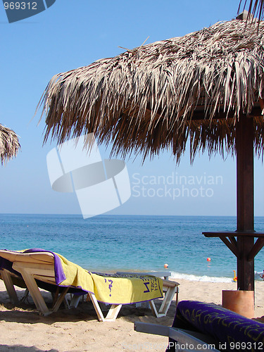 Image of Sunchairs and umbrellas on Beach