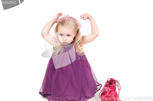 Image of Studio shot of baby girl in gala dress