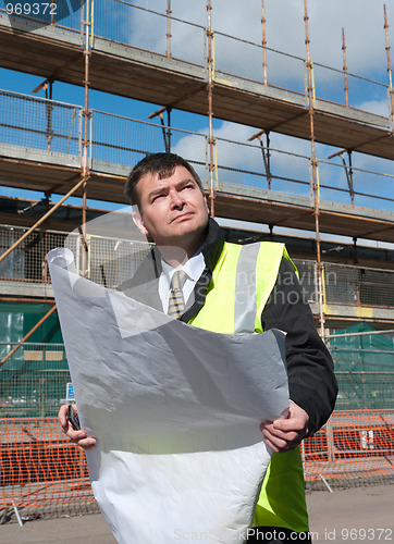 Image of Confident architect or engineer on construction site