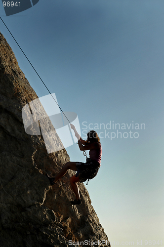 Image of Silhouette Woman Climbing