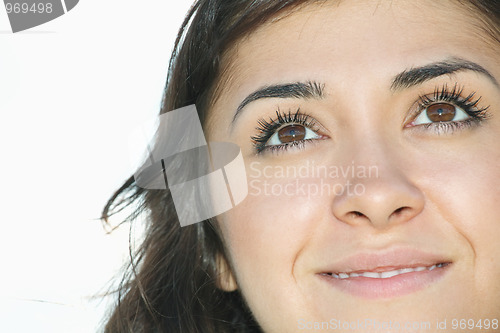 Image of Young brunette looking up closeup