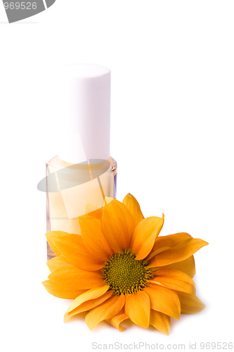 Image of yellow nail polish and flower