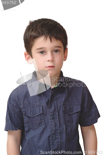 Image of Serious cute little old boy stands isolated on white background