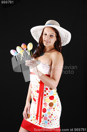 Image of Pretty girl with eastern eggs.