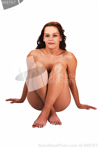 Image of Nude woman sitting on floor.