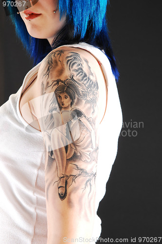 Image of Girl with girl tattoo.