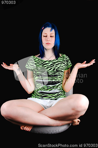 Image of Blue hair girl meditating.