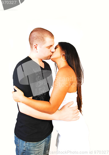 Image of Young couple kissing.