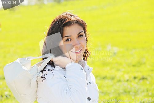Image of Young woman with white bag