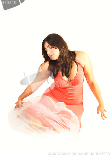 Image of Woman sitting on the floor.