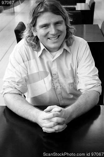 Image of Man sitting at a table